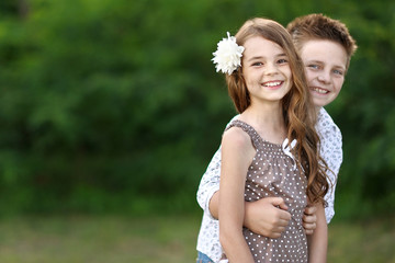 Obraz premium Portrait of a boy girl in a summer