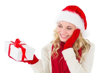 Festive blonde smiling at present