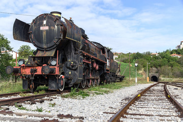 Fototapeta na wymiar Ancient train with a steam locomotive on rails