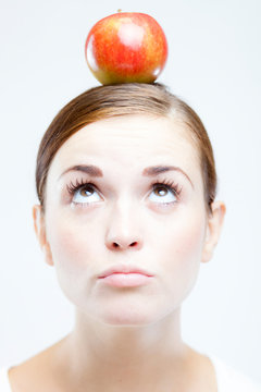 Woman With Red Apple On Her Head