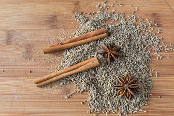 Macro picture from top of autumn spices. Cinnamon, star anise, seeds.