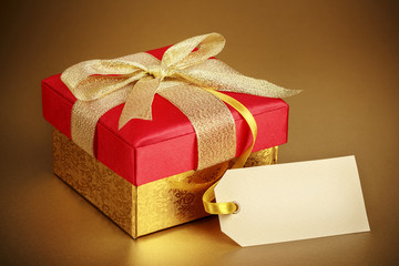 Christmas gift box on gold background