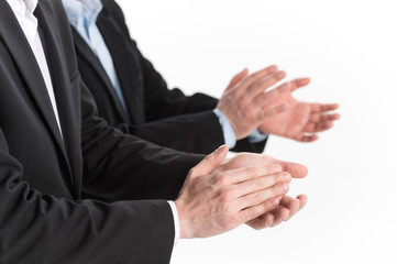 Photo of business people hands applauding at white background.