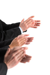 Obraz premium closeup of business people hands applauding at white background.