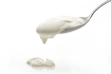Deurstickers cream in spoon isolated © mayamo