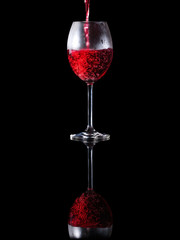 Pouring wine into an elegant glass