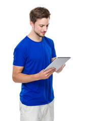 Caucasian man use of digital tablet
