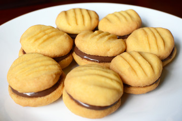 Plate of shortbread biscuits with chocolate filling