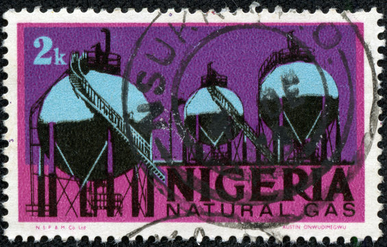 stamp printed in Nigeria featuring natural gas storage tanks
