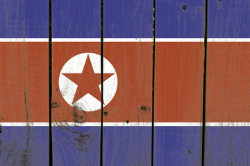 North Korea flag on wooden background