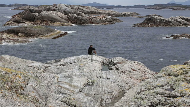 man on Norway island Averoy landscape video