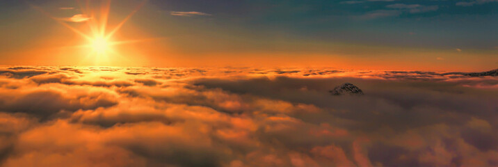Above the clouds panoramic sunrise