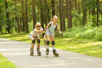 Mom and daughter rollerblade