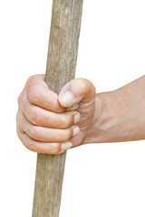 peasant hand holds old wooden cudgel