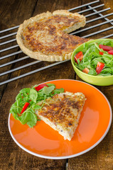 French quiche with cheese and salad