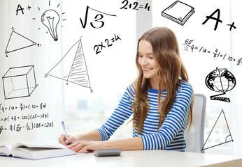 student girl with book, notebook and calculator