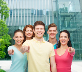 group of smiling teenagers over city background