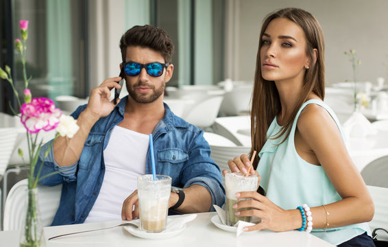 Beautiful woman in cafe with handsome man
