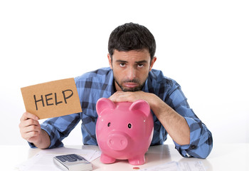 man in stress with piggy bank in bad financial situation