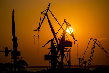 Shipyard cranes at sunset at Pula, Istria, Croatia - 69104534