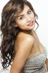 Naklejka premium Beautiful young woman with long hair smiling