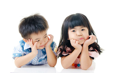 Asian children lying on the floor with cute expression