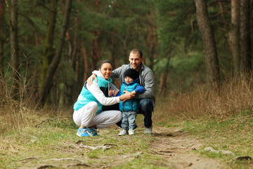 Portrait of beautiful young family of three