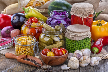 Several kinds of healthy domestic canned vegetables in jars © DDsign