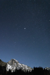 Half dome at Yosemite on a clear, starry, winter night
