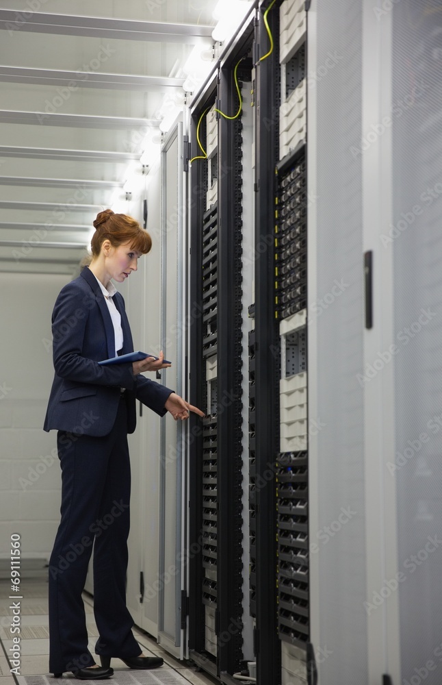 Aufkleber technician working on servers using tablet pc