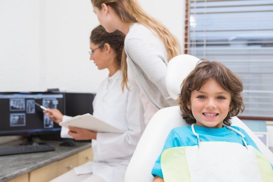 Little boy smiling at camera at dentists