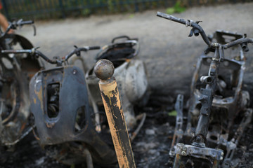 Burnt bikes and scooter after a fire, accident