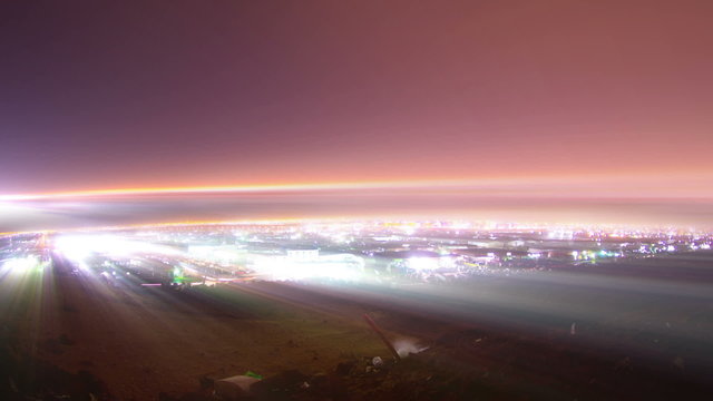 light rays and night of jeddah time lapse over mountain