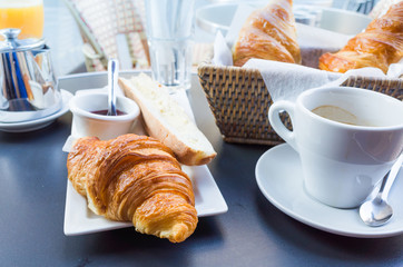 coffee and croissants on table