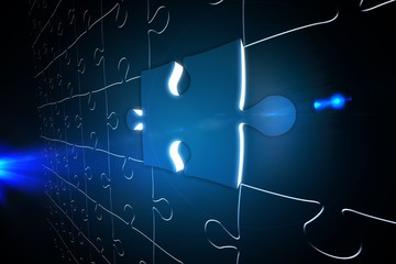 Blue glowing jigsaw piece on puzzle