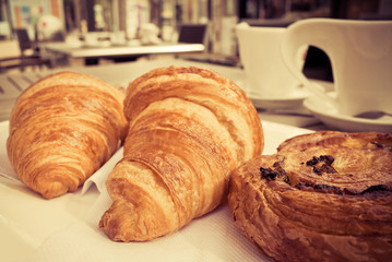 coffee and croissants on table