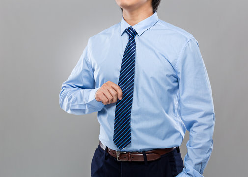 Businessman hand hold with necktie