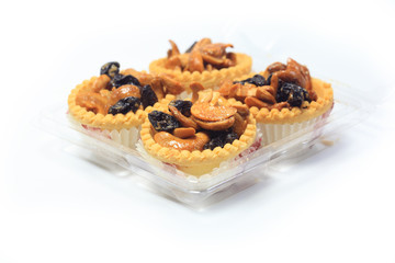 tartlet with dried fruit, on white background
