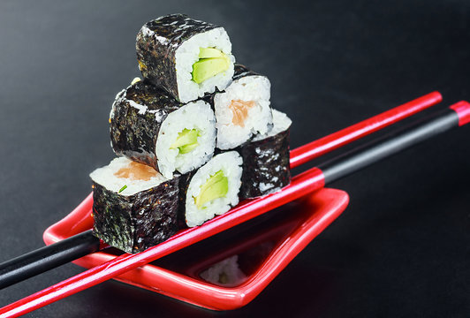 Pyramid of rolls on sticks for sush