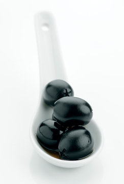 black olives in white bowls