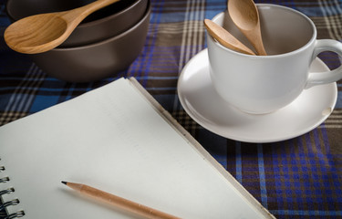 concept of cooking table with note book for cooking plan