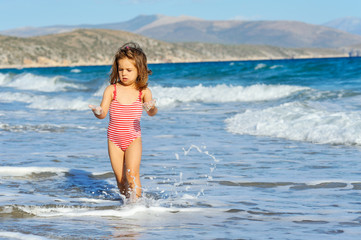 Toddler girl at beach