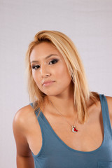 Fototapeta premium Blond woman looking seriously at the camera