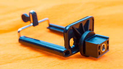 Fototapeta premium Shining Metal Mobile Smart Phone Landcsape Mount Holder Isolated