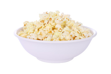 Popcorn in round bowl on white background.