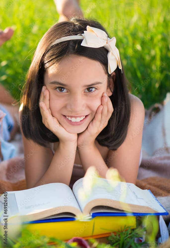 Wall mural happy child studying on nature