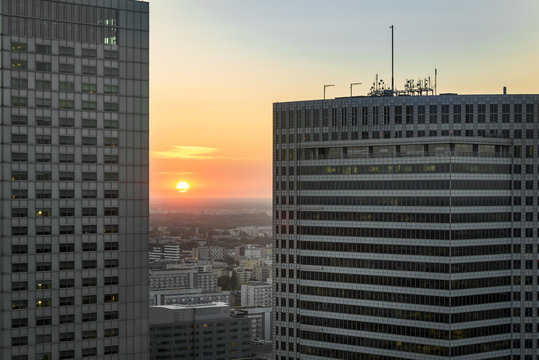 Fototapeta Sundown over Warsaw city with modern buildings