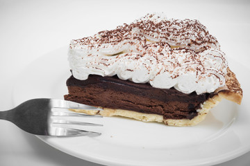 Chocolate tart with fork in white background