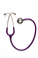 Old purple stethoscope on isolated