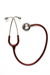 Old red stethoscope on isolated